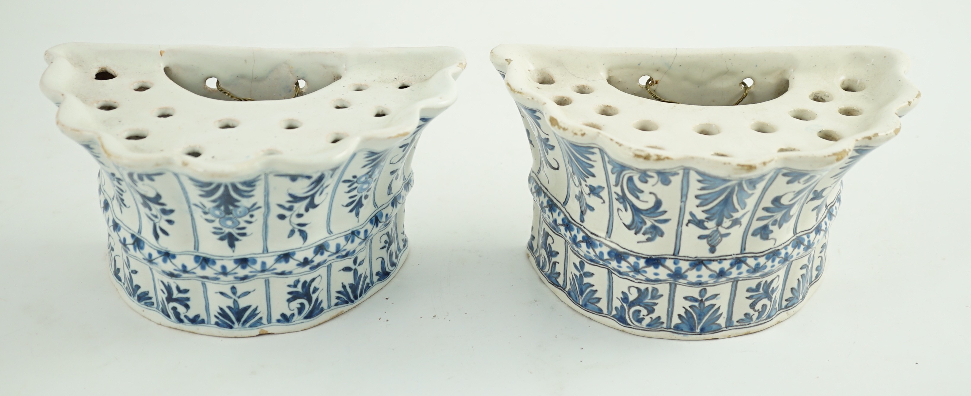 Two similar 18th century Delft blue and white hanging bough pots, 18.3cm wide
